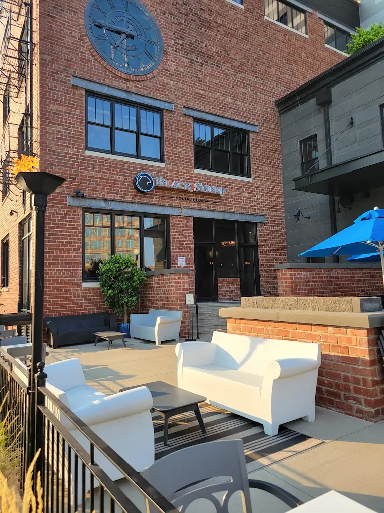 Exterior of Black Sheep Social Club in downtown Cedar Rapids, Iowa showing the commercial patio area